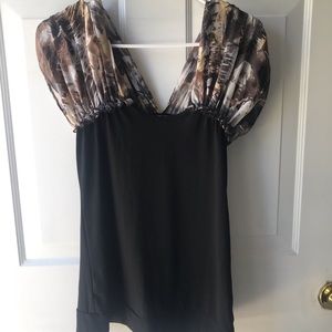 Black top with brown multicolored puff sleeves